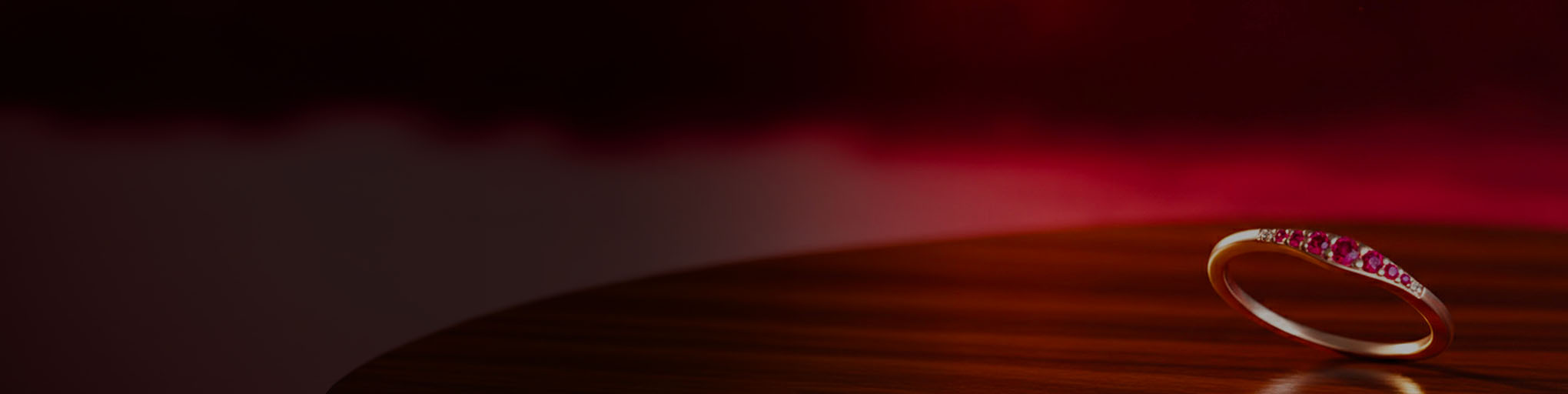 18K rose gold ruby wedding ring with precious red stone pavé, French fine jewellery on red gradient background