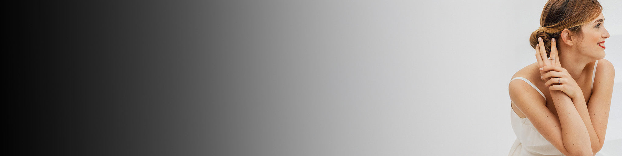 Diamond rings white gold 18K fine jewellery collection worn by elegant woman on grey gradient background