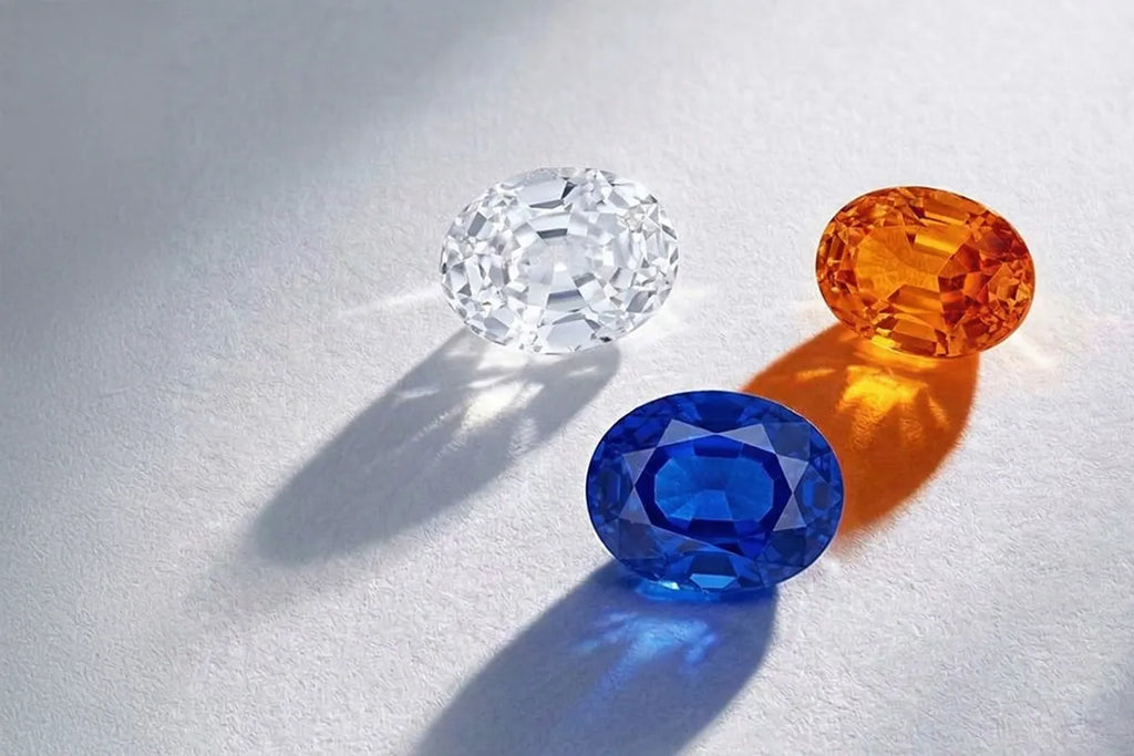 Loose sapphires in a range of colours: orange, blue, white, showcasing the full diversity of a single corundum mineral