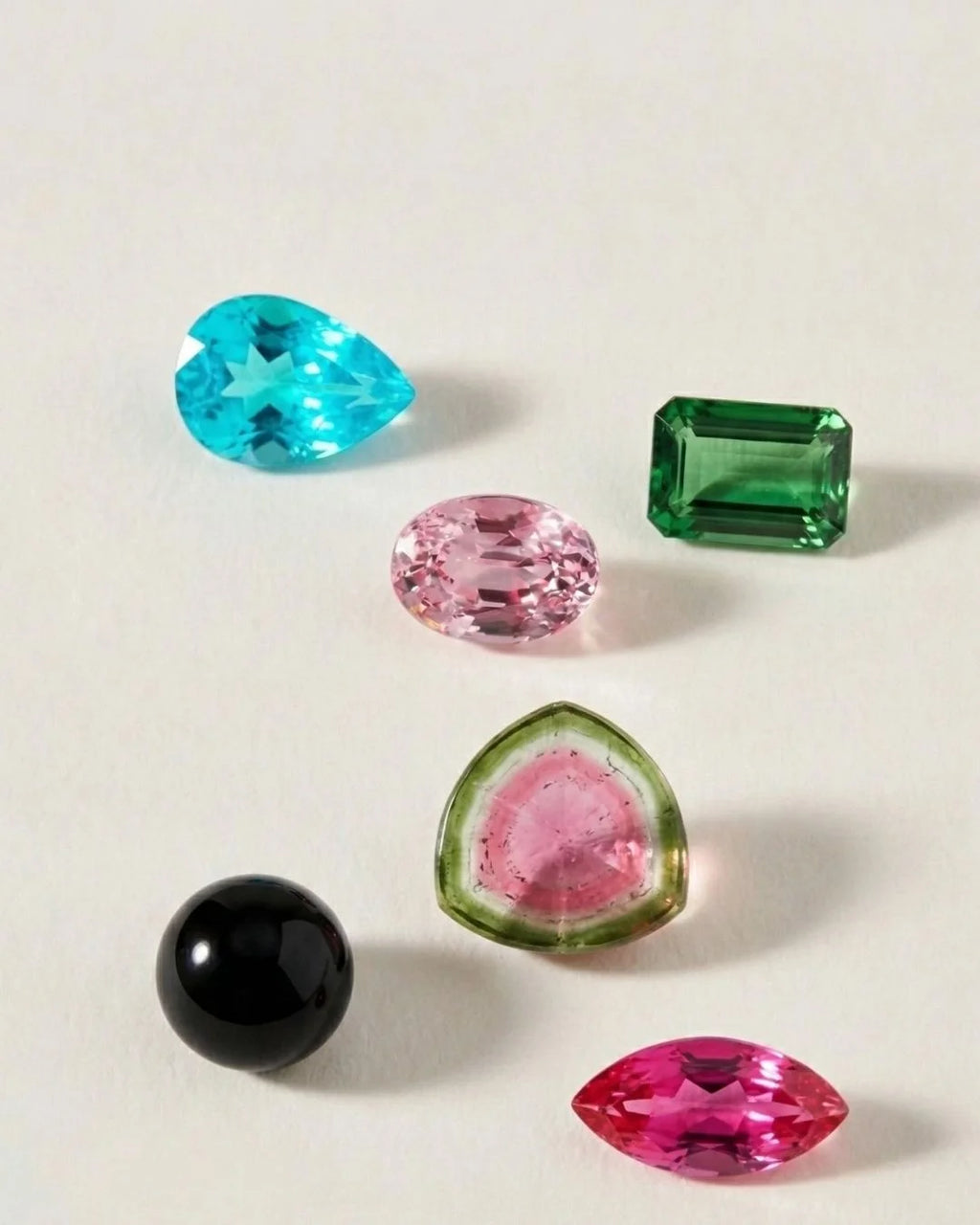 A rainbow of natural tourmalines: pink, green, Paraiba blue, watermelon and black
