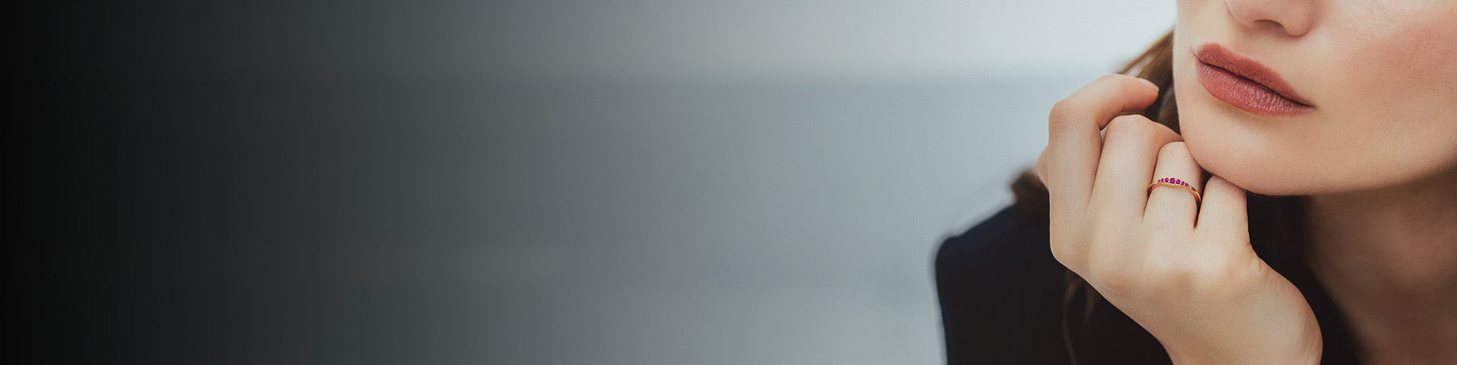 Ruby ring rose gold 18K worn by elegant woman, fine jewellery with red gemstones