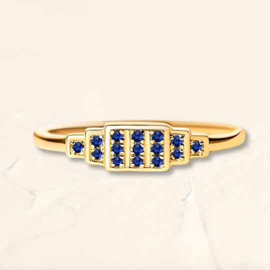 Brami XL geometric ring in yellow gold set with natural sapphires