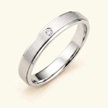 Dhruva diamond wedding band in 18k white gold for men, brushed band bezel setting