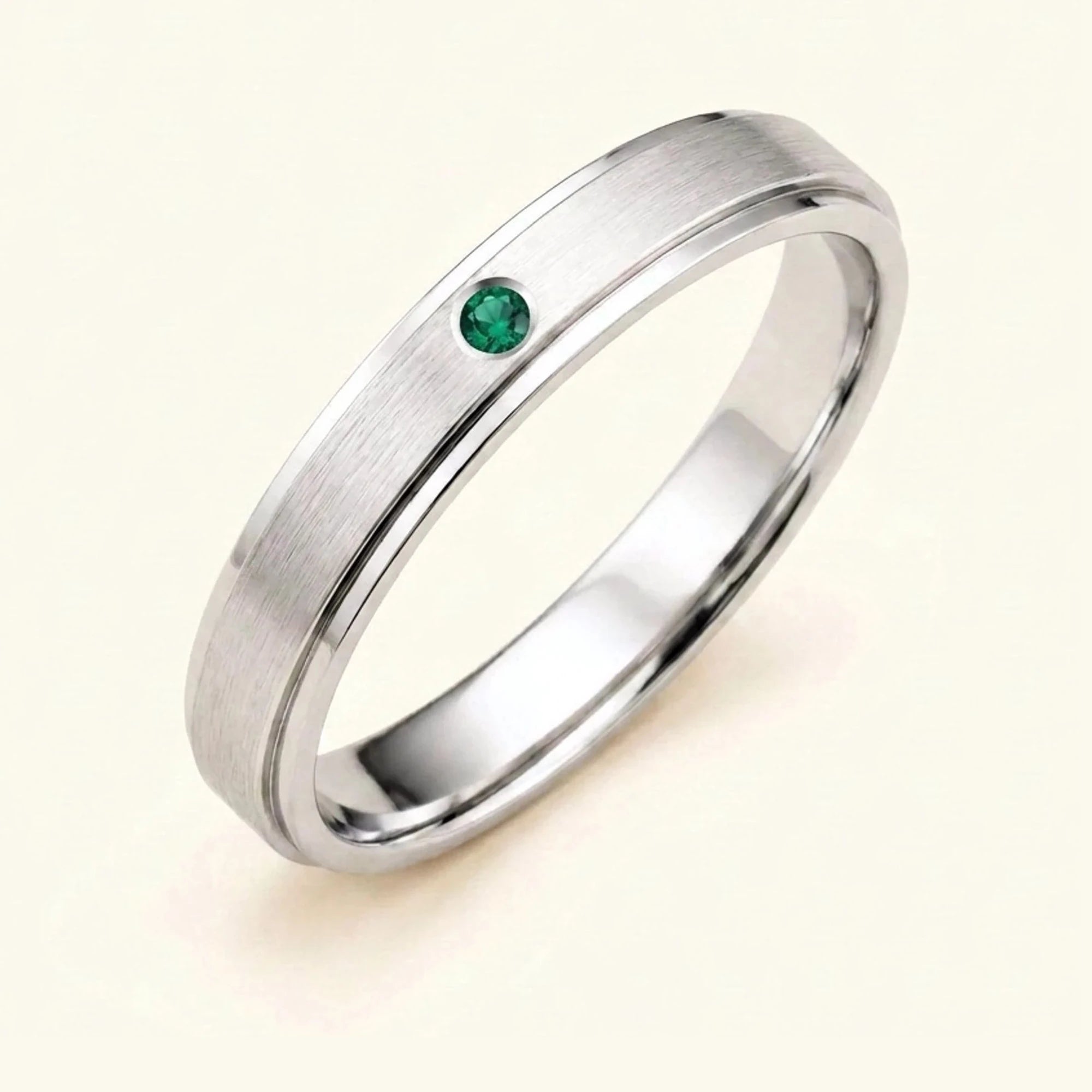 Dhruva emerald wedding band in 18k white gold for men, brushed band bezel setting