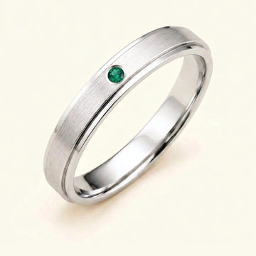 Dhruva emerald wedding band in 18k white gold for men, brushed band bezel setting