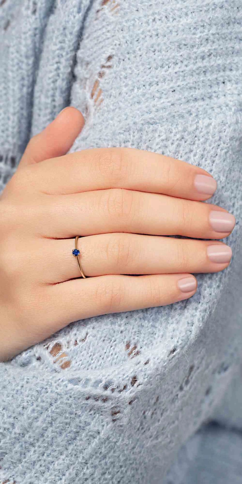 A yellow gold wedding ring worn on the ring finger, tradition and elegance