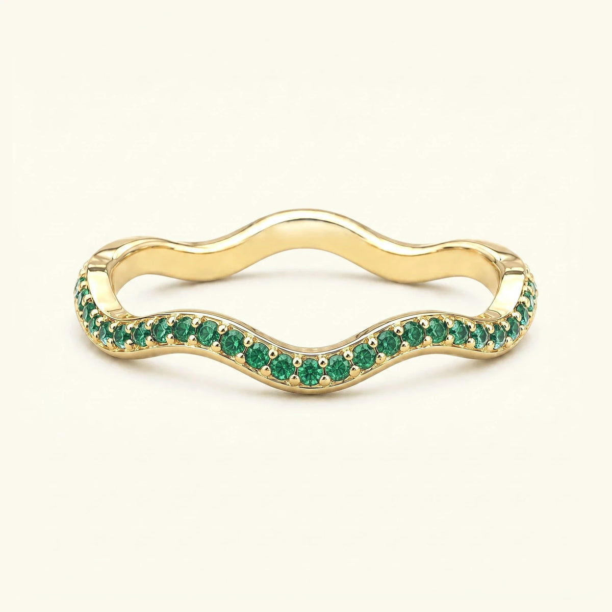 Thalassa wave wedding ring with emeralds in 18K yellow gold, half-eternity pavé set