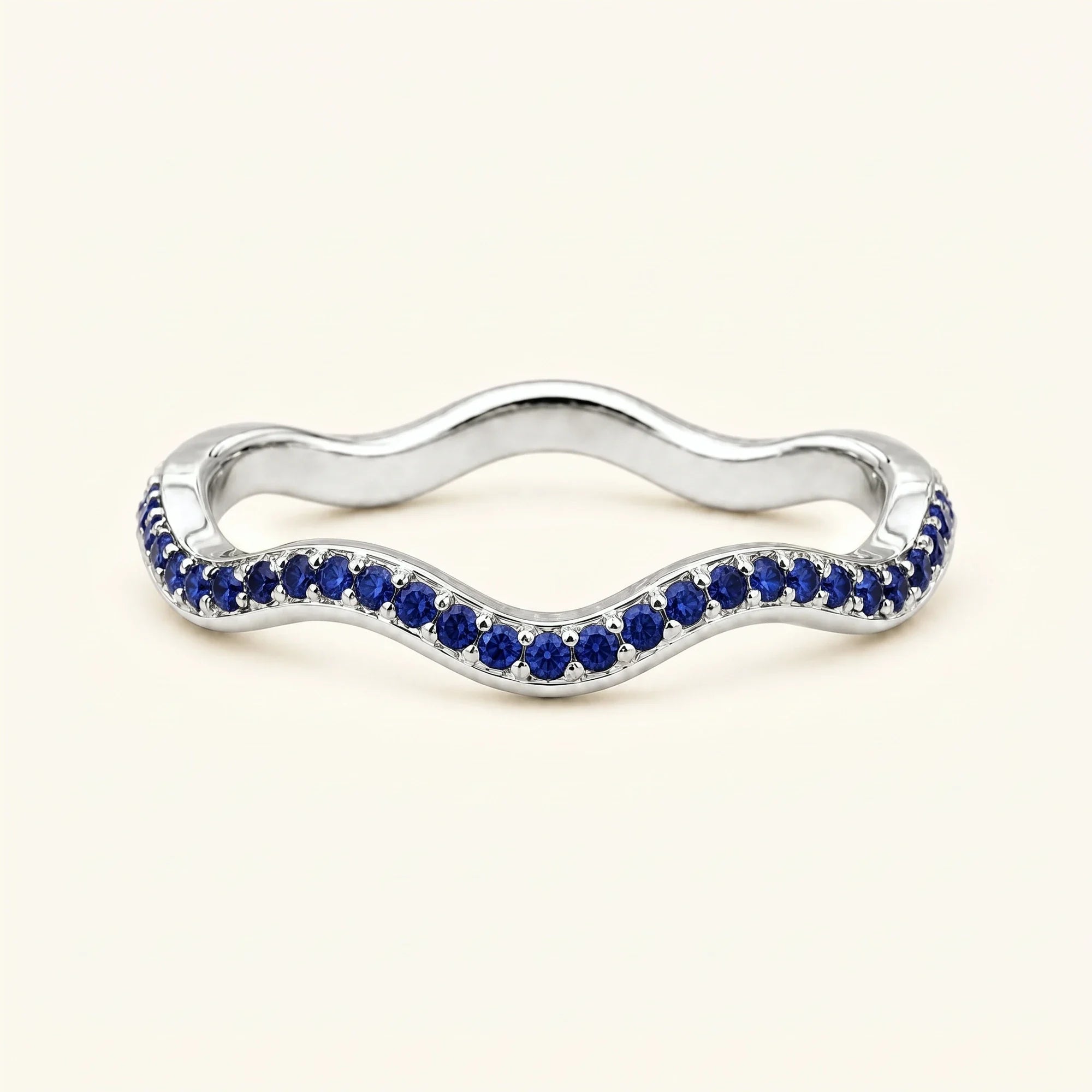 Thalassa wave wedding ring with sapphires in 18K white gold, half-eternity pavé set