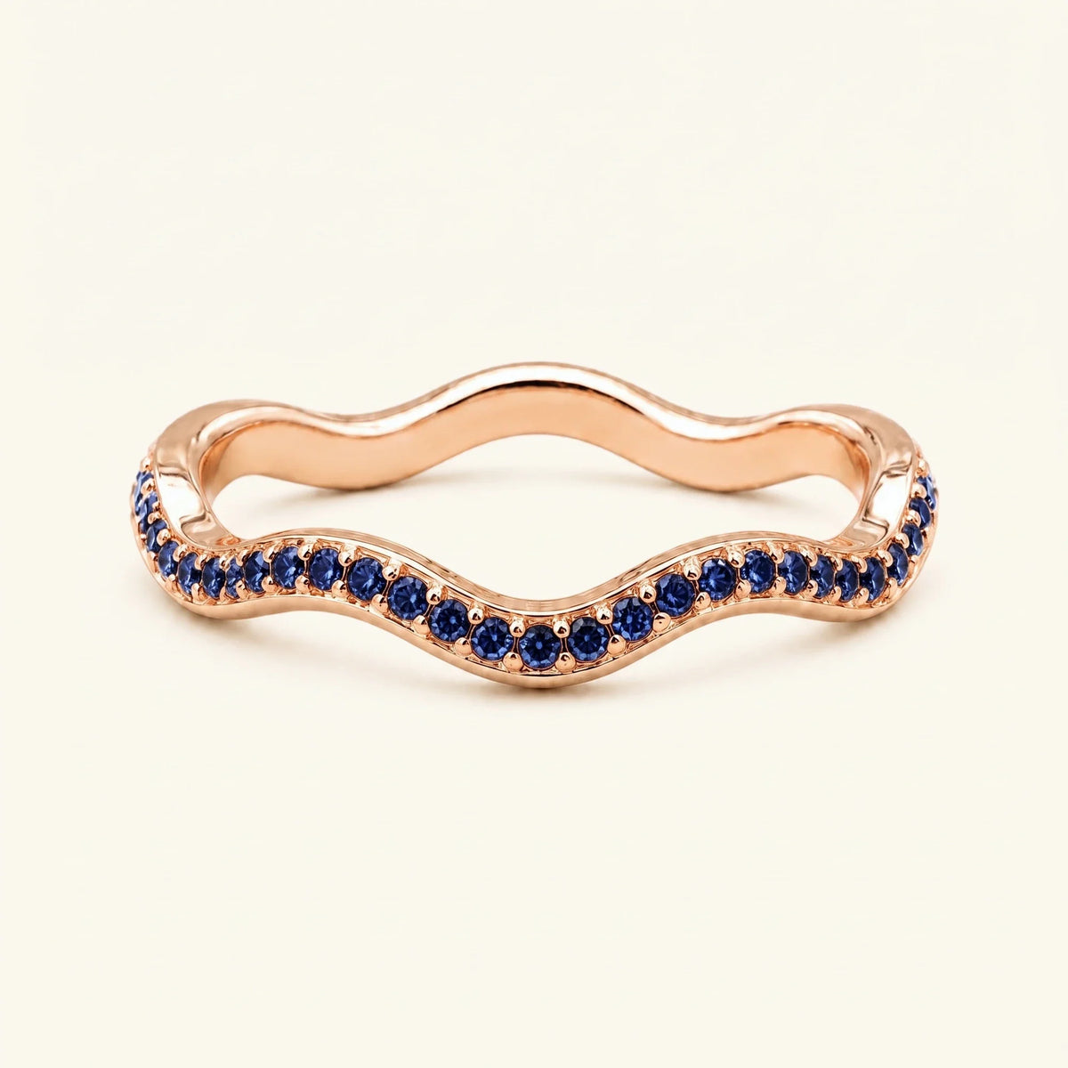 Thalassa wave wedding ring with sapphires in 18K rose gold, half-eternity pavé set