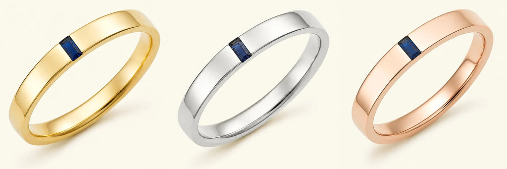 The Agni men's engagement ring in 18ct yellow gold, white gold, and rose gold, set with a baguette cut sapphire