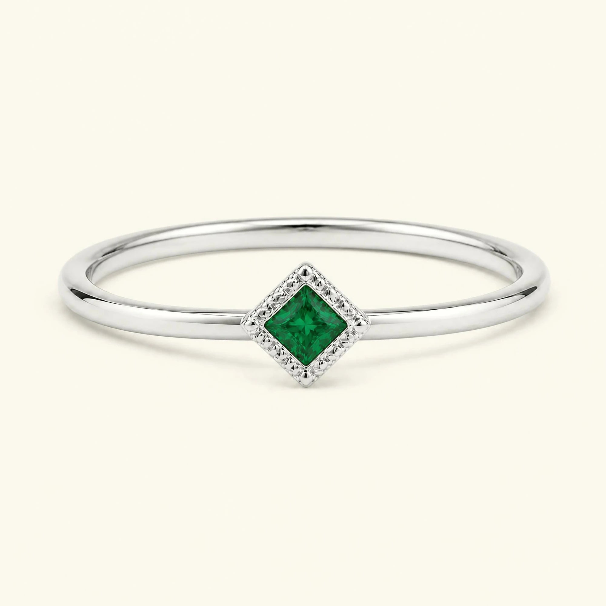 Vintage Indrani engagement ring — emerald solitaire princess cut 4 mm, square stone set milgrain, 18K white gold