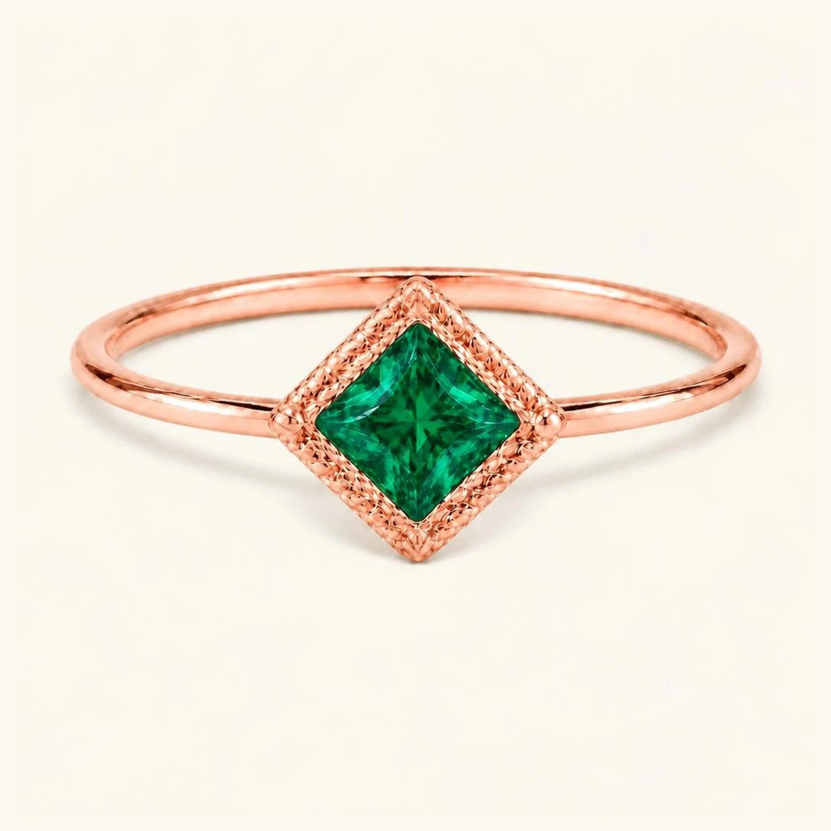 Vintage Indrani engagement ring — emerald solitaire princess cut 4 mm, square stone in twisted rope setting, 18K rose gold