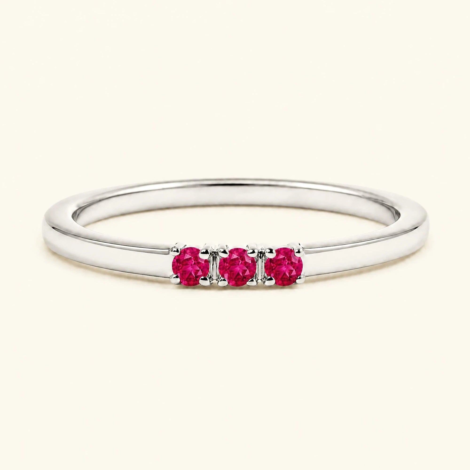 Ruby trilogy engagement ring in white gold