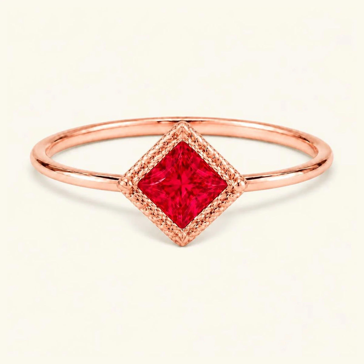 Vintage Indrani engagement ring — ruby solitaire princess cut 4 mm, square stone in twisted rope setting, 18K rose gold
