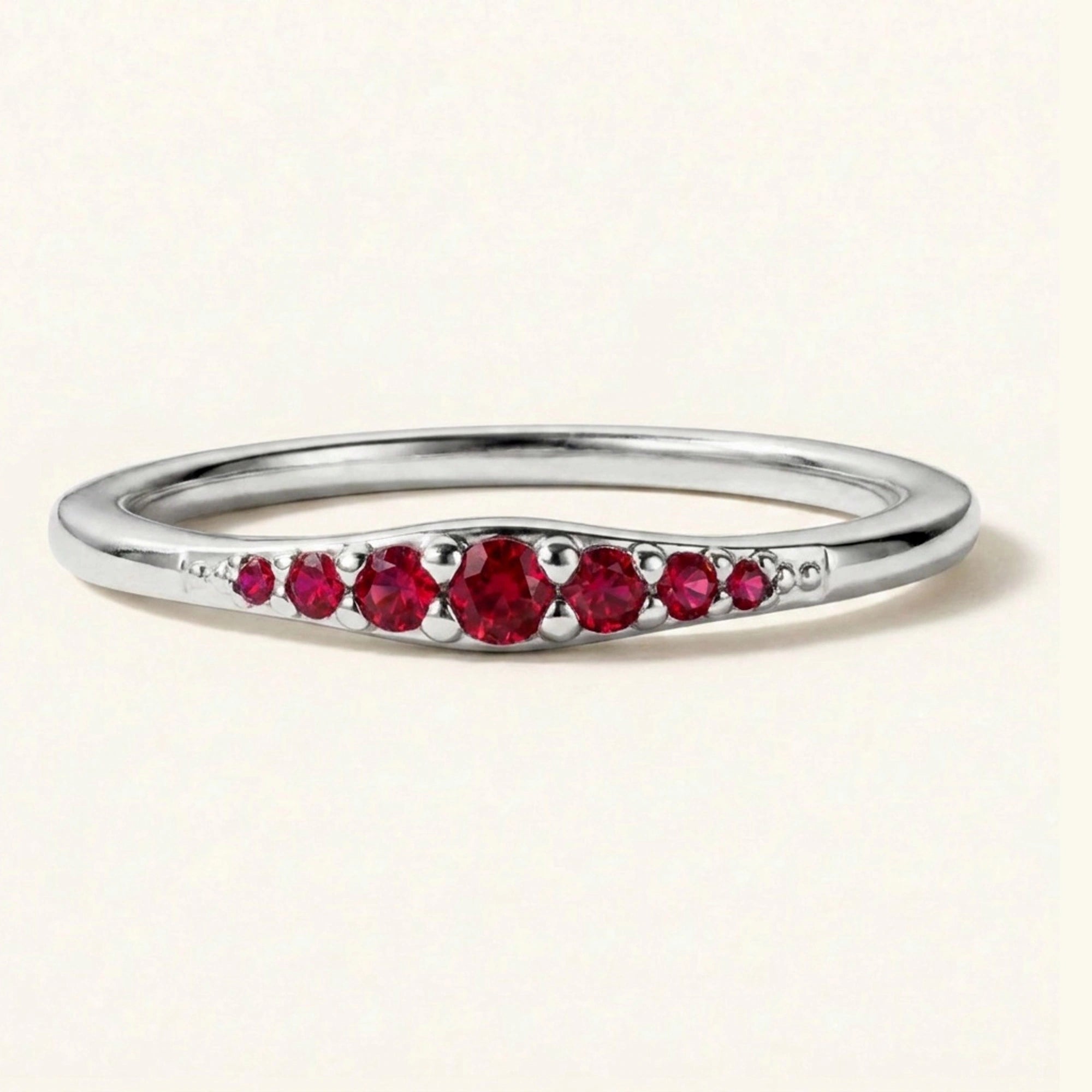 Graduated ruby wedding ring in white gold