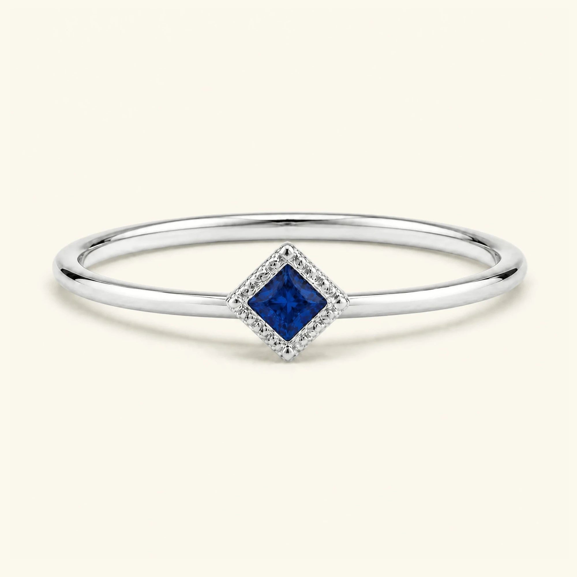 Vintage Indrani engagement ring — sapphire solitaire princess cut 4 mm, square stone in twisted rope setting, 18K white gold