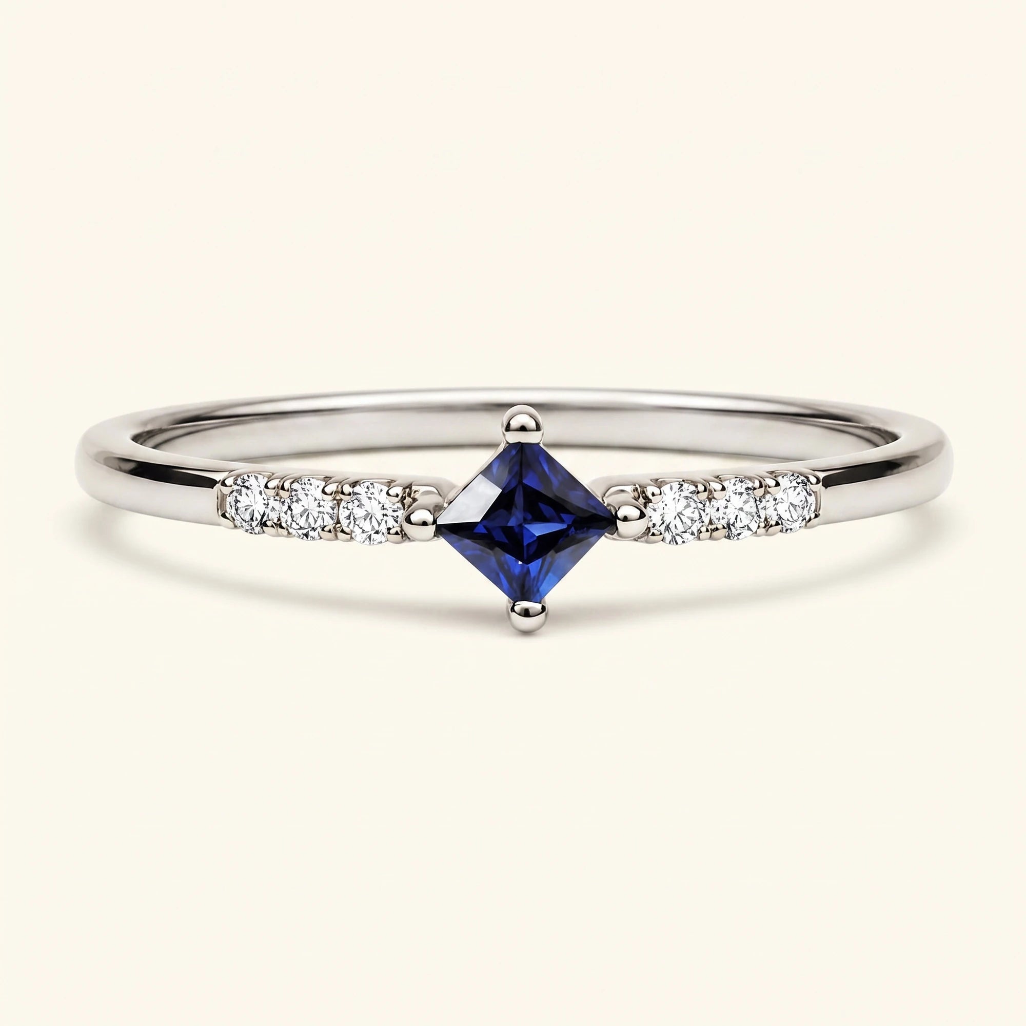 Princess engagement ring sapphire and diamonds in white gold