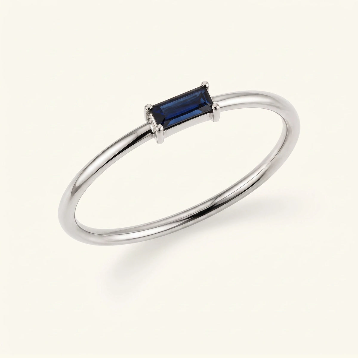 Sapphire solitaire ring baguette cut white gold