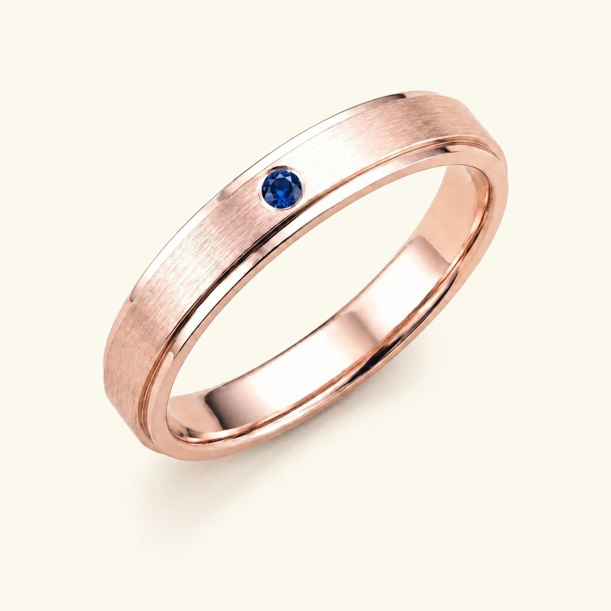 Dhruva sapphire wedding band in 18k rose gold, brushed band bezel setting
