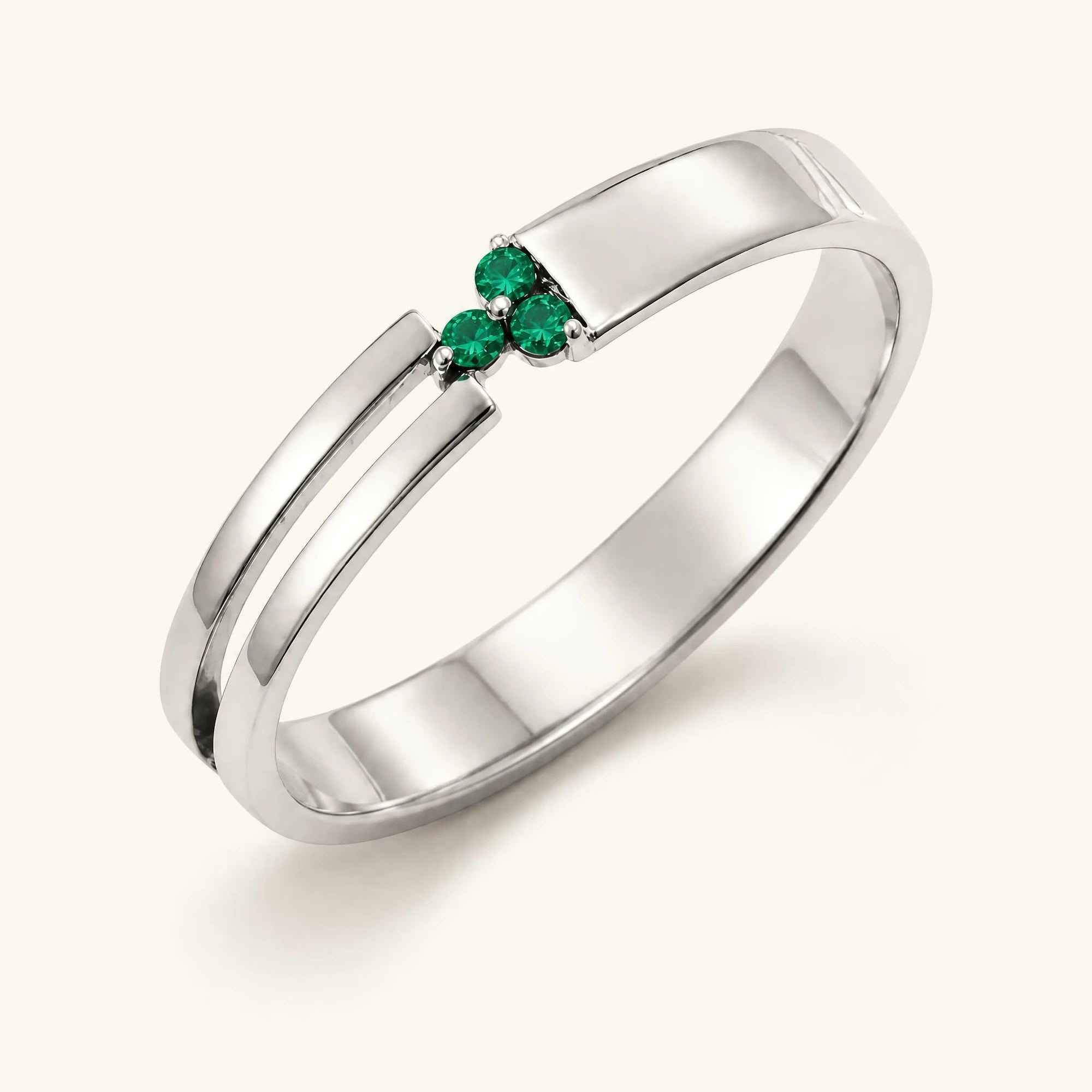 Bague trois pierres d'émeraudes pour homme en or blanc