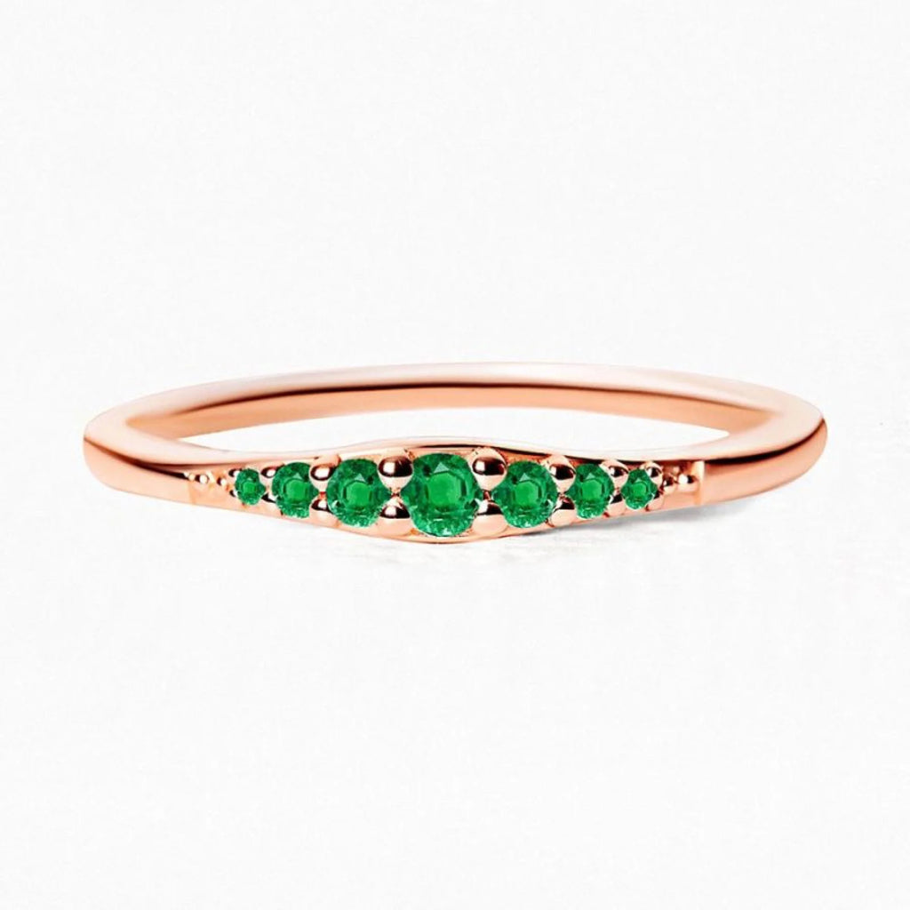 A rose gold and Emerald ring, an unexpected combination that transcends convention