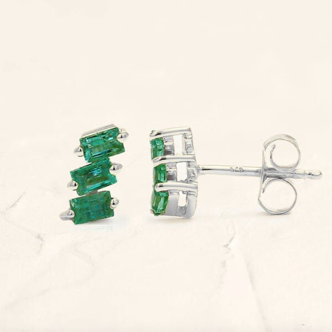 Jivane asymmetric emerald earrings in white gold
