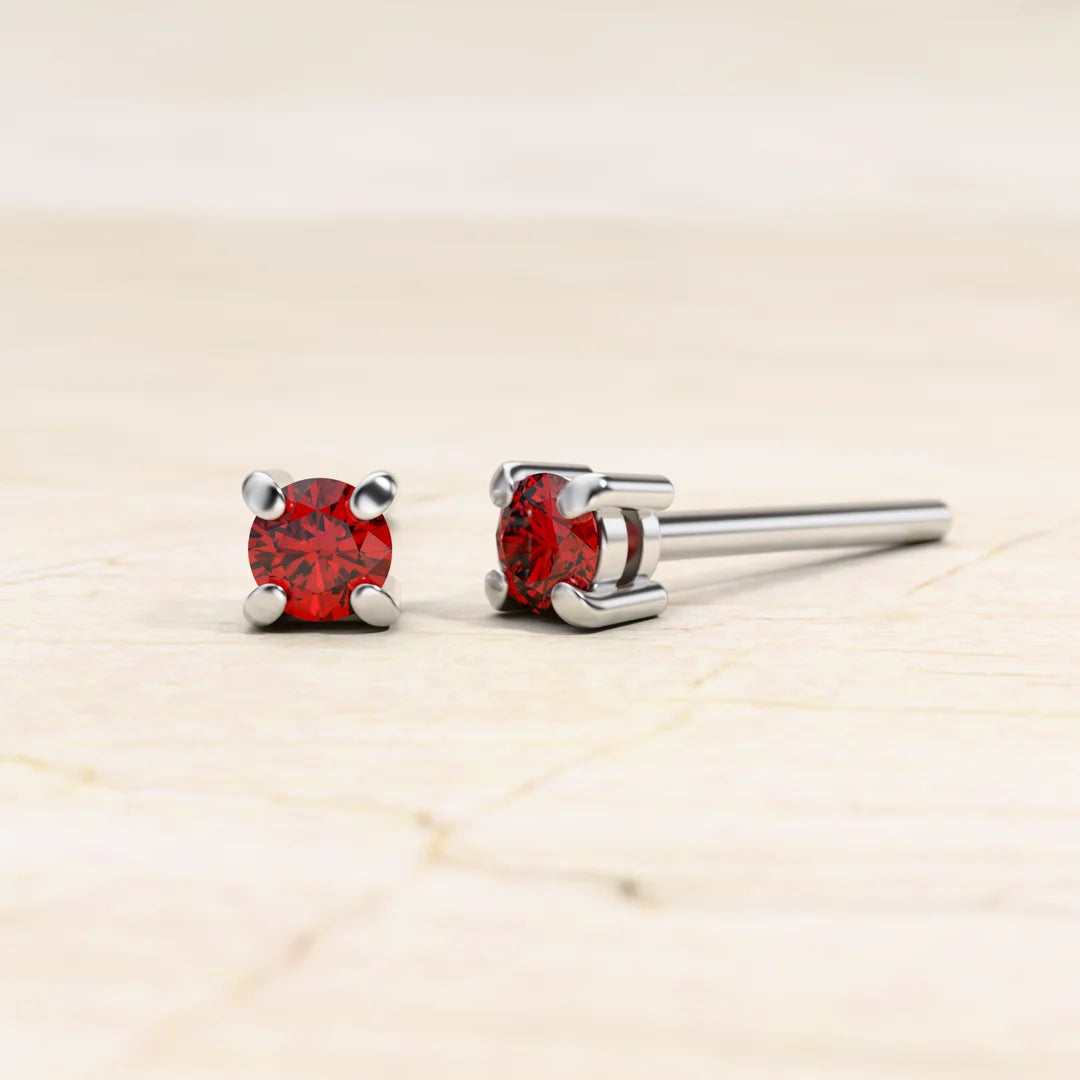 Solitaire ruby earrings in 18K white gold