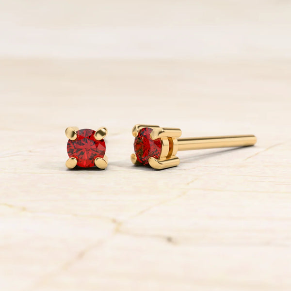 Solitaire ruby earrings in 18K yellow gold
