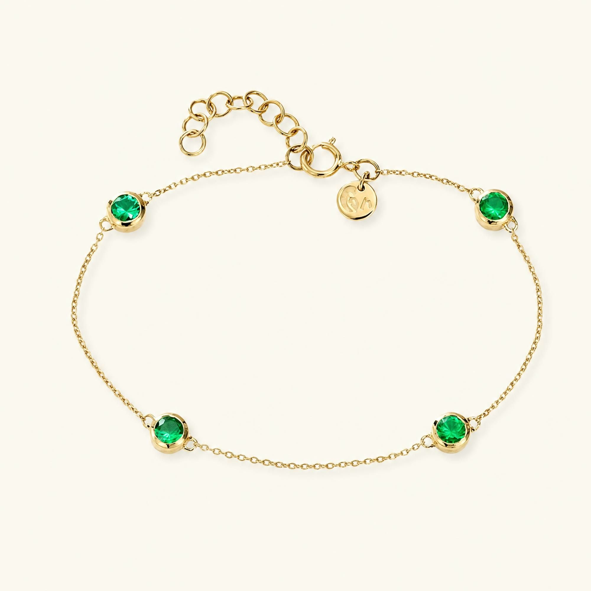 Dhanya bracelet with closed settings of four natural emeralds