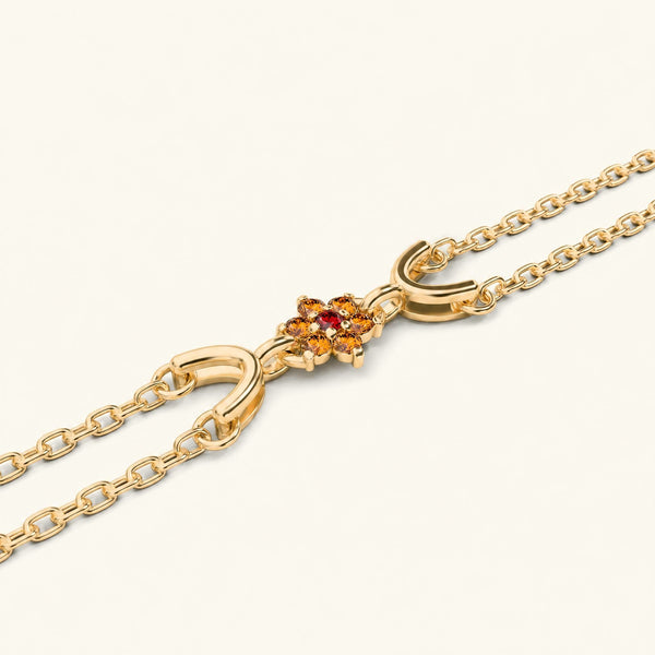 Surya yellow gold bracelet for women with orange sapphire