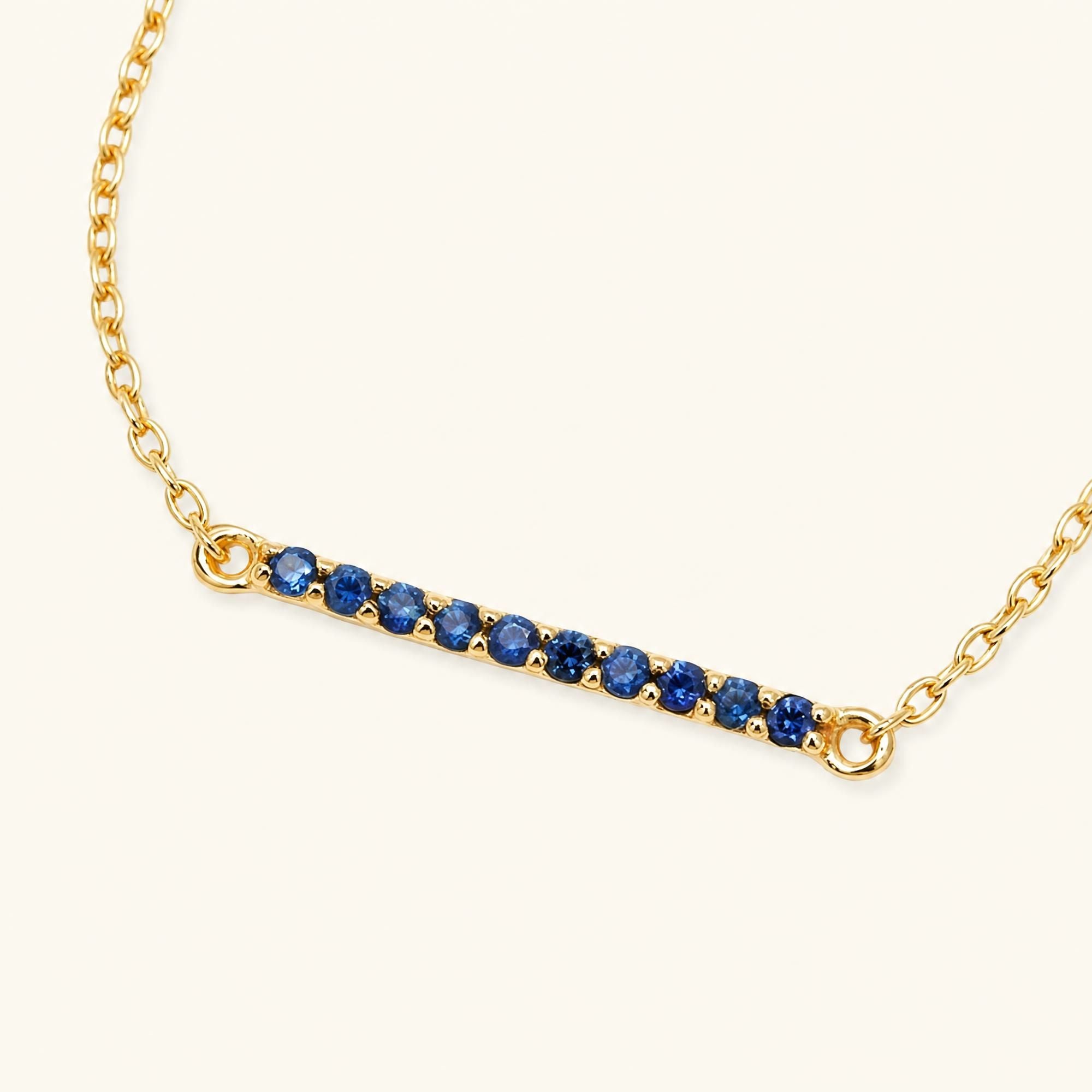 Long bar ruby bracelet in yellow gold