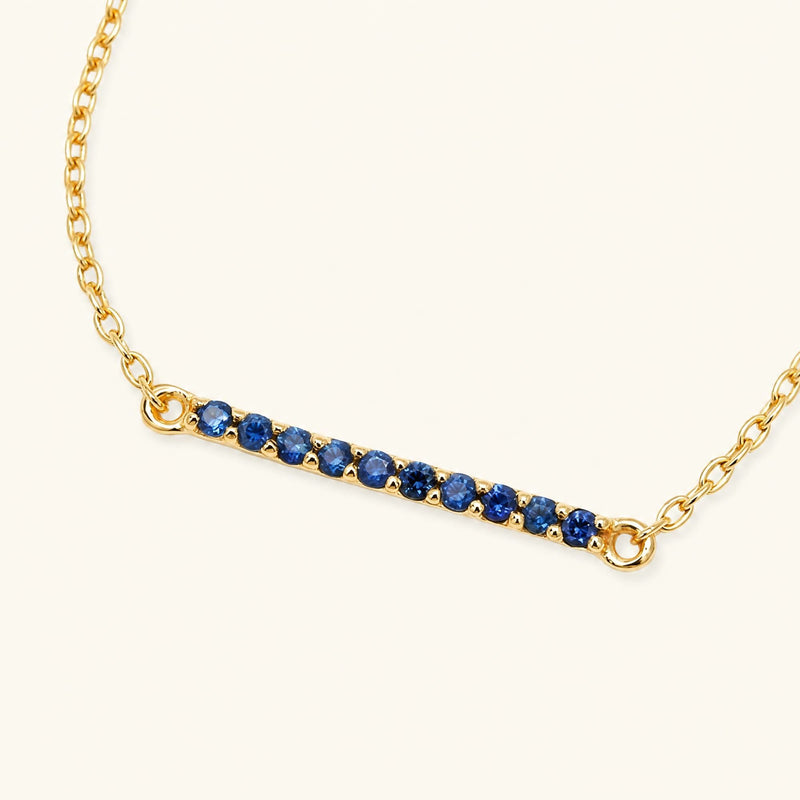 Long bar ruby bracelet in yellow gold