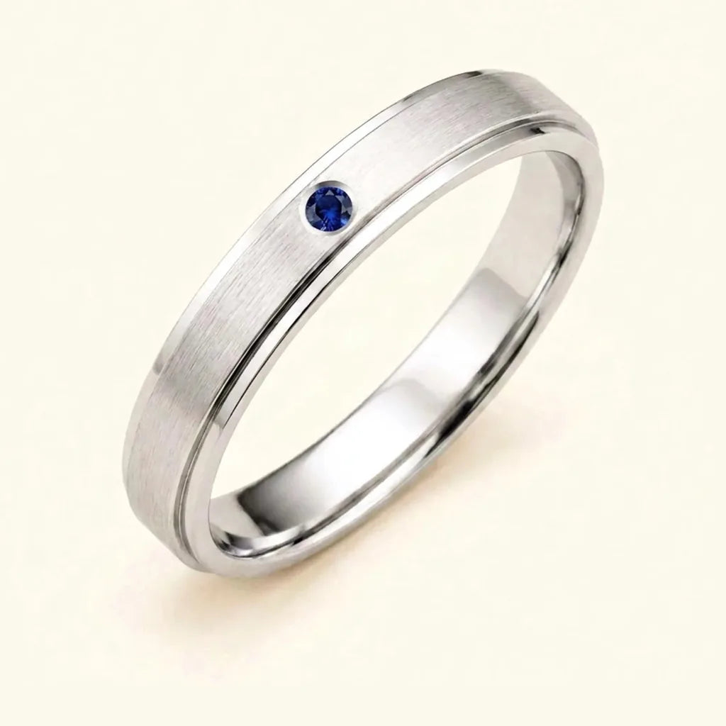 Dhruva men's ring in 18ct white gold with a flush-set sapphire, a best man gift