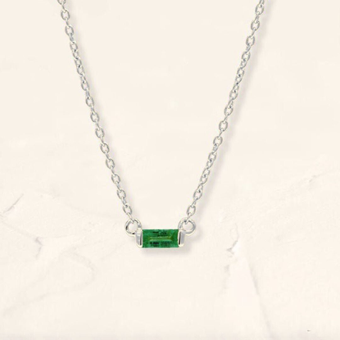 Shanti emerald baguette necklace in white gold