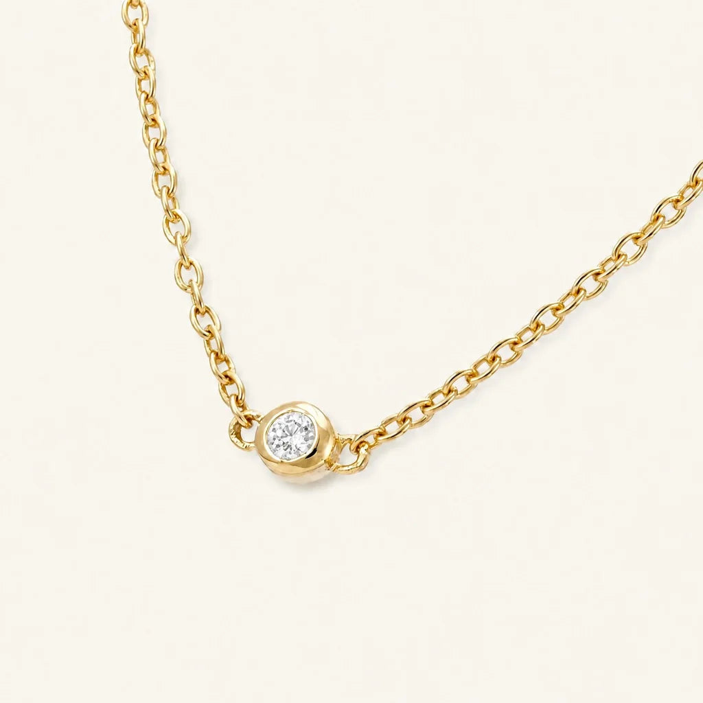 The Asonya necklace in 18ct yellow gold with a bezel-set diamond, by Mayuri