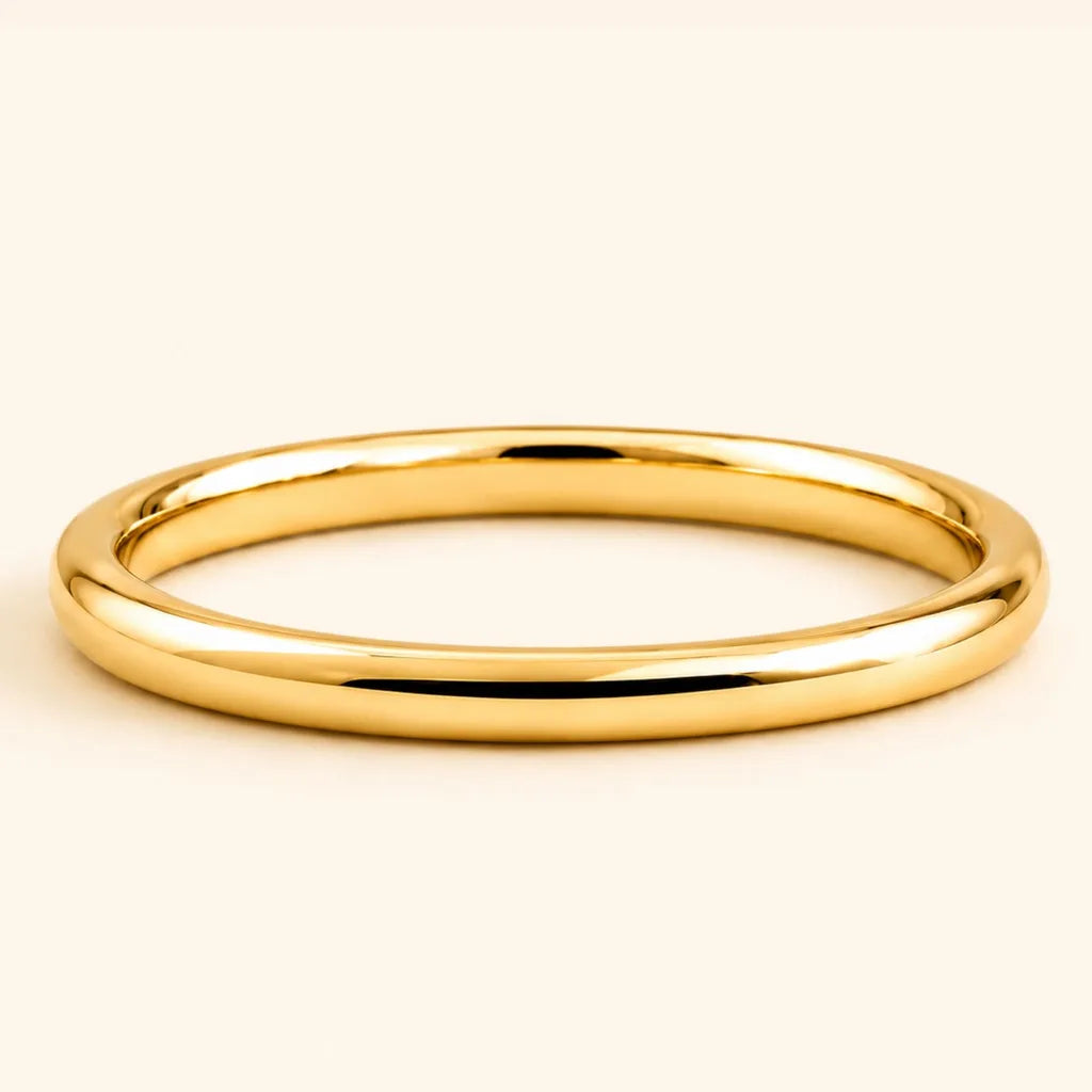 Shunya round bangle wedding ring in 18ct yellow gold with a polished, high-shine finish, by Mayuri