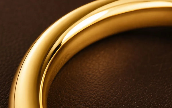 18K yellow gold wedding rings macro showing smooth and bright precious metal surface by Mayuri